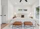 Bright main bedroom features hardwood floors, plush rug, and stylish furnishings at 42 Poinsett St # B, Charleston, SC 29403