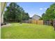 Large backyard with a firepit, seating and wood fence at 432 Equinox Cir, Ladson, SC 29456