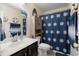 Nautical themed bathroom with vanity and enclosed cabinet for storage at 432 Equinox Cir, Ladson, SC 29456