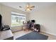 Inviting bedroom includes a ceiling fan, desk, and a window with a view at 432 Equinox Cir, Ladson, SC 29456
