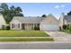 Charming single-story home with a well-maintained lawn and attached garage, offering curb appeal at 432 Equinox Cir, Ladson, SC 29456