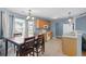 Charming kitchen with wooden cabinets, adjacent dining area, and ample counter space for cooking at 432 Equinox Cir, Ladson, SC 29456