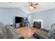 Bright living room with vaulted ceiling, features a fireplace, hardwood floors and comfortable seating at 432 Equinox Cir, Ladson, SC 29456