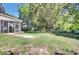 Backyard with a privacy fence, shade trees, and a screened in porch on the home at 434 Antebellum Ln, Mount Pleasant, SC 29464