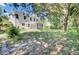 Expansive backyard with mature trees, green grass, and screened-in porch at 434 Antebellum Ln, Mount Pleasant, SC 29464