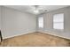 This bedroom features two windows, neutral colored walls and carpet flooring at 434 Antebellum Ln, Mount Pleasant, SC 29464