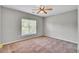 This bedroom features a ceiling fan, neutral colored walls and carpet flooring at 434 Antebellum Ln, Mount Pleasant, SC 29464