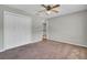 This bedroom has neutral walls, carpet flooring, a closet and a ceiling fan at 434 Antebellum Ln, Mount Pleasant, SC 29464