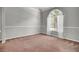 Neutral-toned bedroom with plush carpeting, a large window, and ample natural light at 434 Antebellum Ln, Mount Pleasant, SC 29464