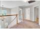 Well-lit hallway with chandelier and access to multiple rooms at 434 Antebellum Ln, Mount Pleasant, SC 29464