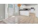 Bright breakfast nook with tiled floors, pendant lighting, and views of the updated kitchen with white cabinetry at 434 Antebellum Ln, Mount Pleasant, SC 29464