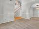 Spacious living room area featuring neutral carpeting and an arched doorway to the dining area at 434 Antebellum Ln, Mount Pleasant, SC 29464