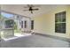 This screened porch features concrete flooring, a ceiling fan and access to the backyard at 434 Antebellum Ln, Mount Pleasant, SC 29464