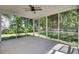 This screened porch has concrete flooring, a ceiling fan and lots of natural light at 434 Antebellum Ln, Mount Pleasant, SC 29464