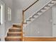 Elegant staircase with wooden banister and carpeted steps at 434 Antebellum Ln, Mount Pleasant, SC 29464