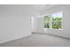 Bright bedroom with natural light, plush carpet, and neutral walls at 4436 Oakwood Ave, North Charleston, SC 29405