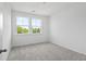 Well-lit bedroom with plush carpet, offering a comfortable retreat at 4436 Oakwood Ave, North Charleston, SC 29405