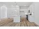 Open concept kitchen with white cabinets, stainless steel appliances, and a stylish kitchen island at 4436 Oakwood Ave, North Charleston, SC 29405