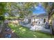 Inviting backyard featuring a deck with seating and artificial grass, perfect for outdoor enjoyment at 512 Castle Hall Rd, Mount Pleasant, SC 29464