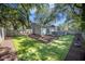 Private backyard with artificial turf, wooden fence, and a wood deck at 512 Castle Hall Rd, Mount Pleasant, SC 29464