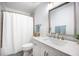 Bright bathroom with shower-tub, marble vanity, and updated fixtures at 512 Castle Hall Rd, Mount Pleasant, SC 29464