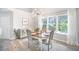 Bright dining room with modern chandelier, and a buffet cabinet at 512 Castle Hall Rd, Mount Pleasant, SC 29464