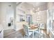 Dining room with modern chandelier, wood table and comfortable chairs at 512 Castle Hall Rd, Mount Pleasant, SC 29464