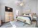 Bright main bedroom with a king bed, walk in closet, and an en-suite bathroom at 512 Castle Hall Rd, Mount Pleasant, SC 29464