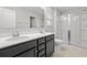 Bright bathroom features a double sink vanity with shower and glass door at 514 Purple Finch Rd, Summerville, SC 29486