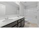 Bright bathroom featuring double sinks, a large mirror, and a shower-tub combination at 514 Purple Finch Rd, Summerville, SC 29486
