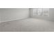 Bright bedroom with three windows, and neutral carpet and walls at 514 Purple Finch Rd, Summerville, SC 29486