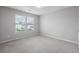 Cozy bedroom with plush carpeting and a window overlooking the neighborhood at 514 Purple Finch Rd, Summerville, SC 29486