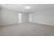 Spacious carpeted bedroom with neutral paint, bright lighting, and doorways to other rooms at 514 Purple Finch Rd, Summerville, SC 29486