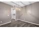 Dining room with modern chandelier and view into the kitchen at 514 Purple Finch Rd, Summerville, SC 29486