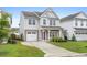 Charming two-story home with a well-manicured lawn, inviting entryway and attached garage at 514 Purple Finch Rd, Summerville, SC 29486