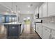 Spacious kitchen features a long island, stainless steel appliances, and backyard views at 514 Purple Finch Rd, Summerville, SC 29486