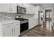 Well-lit kitchen featuring stainless steel appliances, granite countertops, and stylish backsplash at 514 Purple Finch Rd, Summerville, SC 29486