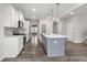 Bright kitchen with stainless steel appliances, an island, and a view to the entryway at 514 Purple Finch Rd, Summerville, SC 29486
