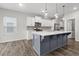 Modern eat-in kitchen featuring stainless steel appliances, large island and hardwood flooring at 514 Purple Finch Rd, Summerville, SC 29486
