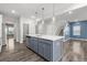 Modern eat-in kitchen featuring stainless steel appliances, large island and hardwood flooring at 514 Purple Finch Rd, Summerville, SC 29486