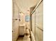 Bathroom featuring a single sink vanity, shower and decorative wallpaper at 524 Kell Pl, Charleston, SC 29412