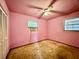 Bedroom with pink walls, laminate wood flooring, and a ceiling fan at 524 Kell Pl, Charleston, SC 29412