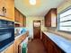 Outdated kitchen featuring wood cabinets, laminate countertops and an oven range at 524 Kell Pl, Charleston, SC 29412