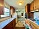 Outdated kitchen area with wood cabinets, laminate countertops, and appliances at 524 Kell Pl, Charleston, SC 29412