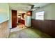 Outdated kitchen featuring wood cabinets, an old refrigerator, and worn flooring at 524 Kell Pl, Charleston, SC 29412