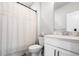 Clean bathroom featuring a white vanity, toilet, and shower with a curtain at 582 Mclernon Trce, Johns Island, SC 29455