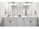 Bright bathroom featuring a double vanity with white cabinets and modern fixtures at 582 Mclernon Trce, Johns Island, SC 29455