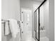 Modern bathroom features a glass-enclosed shower with a built-in bench and white tile at 582 Mclernon Trce, Johns Island, SC 29455