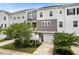 Charming townhome with a white picket fence, attached garage and lush landscaping at 582 Mclernon Trce, Johns Island, SC 29455