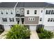 Aerial view of townhomes with private garages, landscaped yards and modern architecture at 582 Mclernon Trce, Johns Island, SC 29455